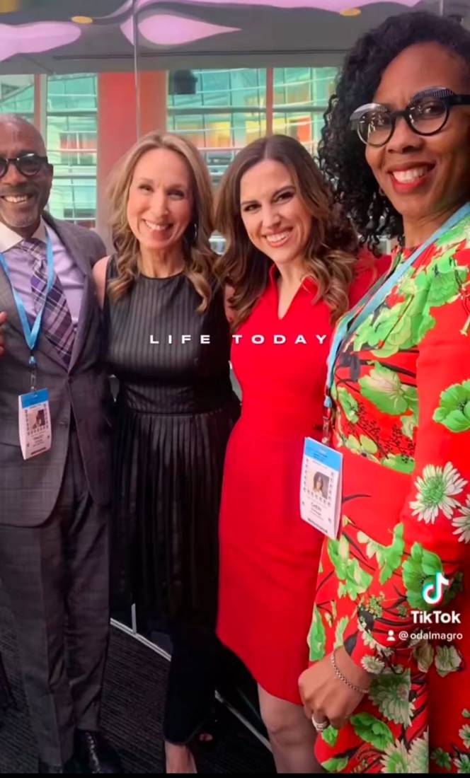 Cheri Syphax with hosts and guests at the Bloomberg Radio studio