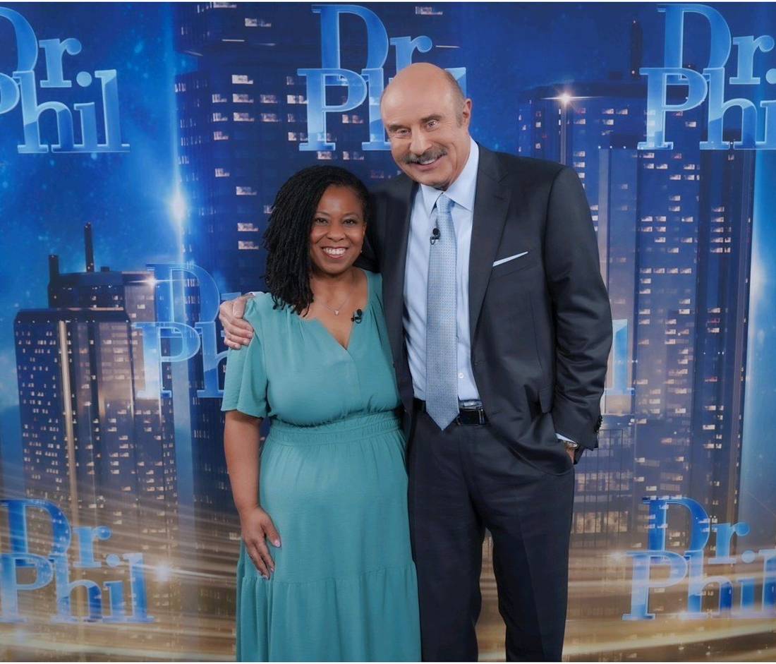 Client with the host on the Dr. Phil set