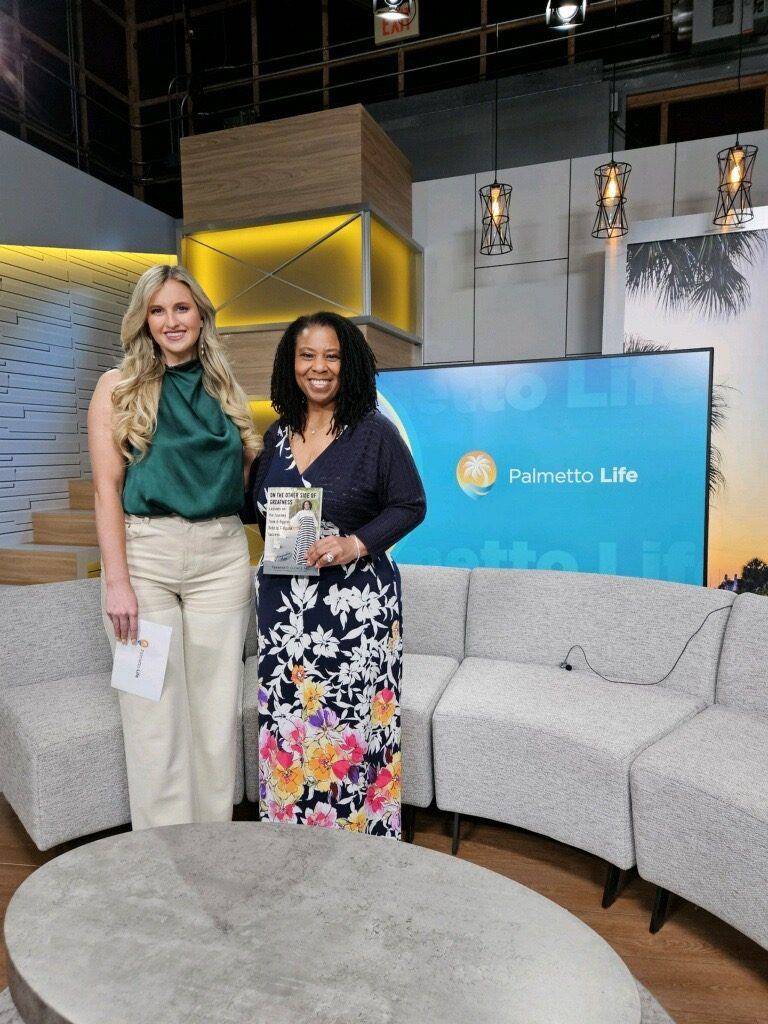 Author with her book and the host on the Palmetto Life set